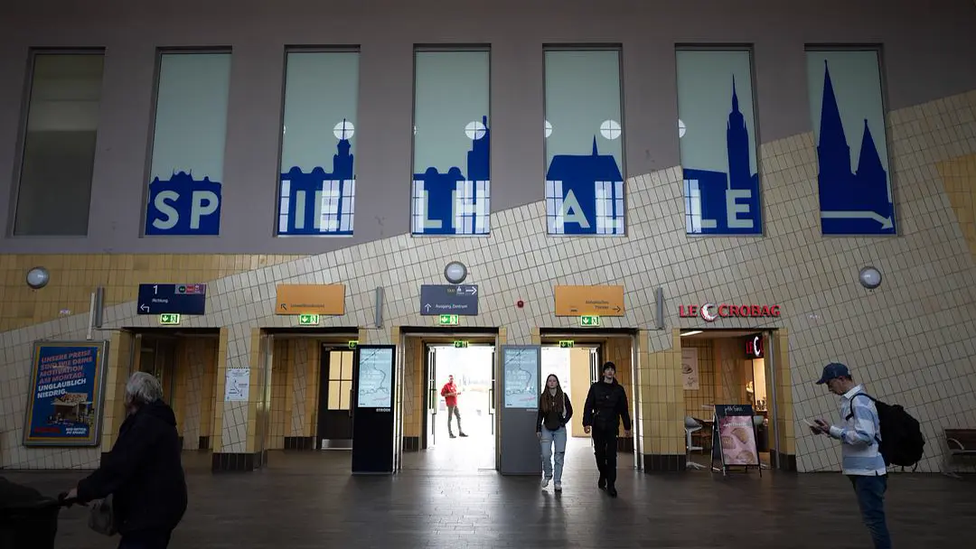 Mini train station, few shops, few people